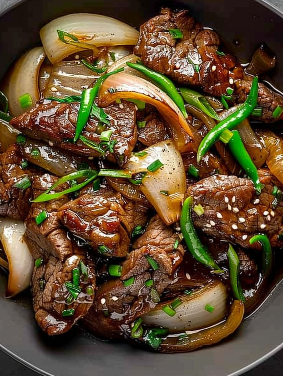 A bowl of beef and onions.